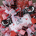 Whimsical Valentine's Day Wreath: Red, Black, and Glitter Skunks