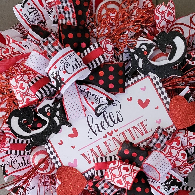 Whimsical Valentine's Day Wreath: Red, Black, and Glitter Skunks