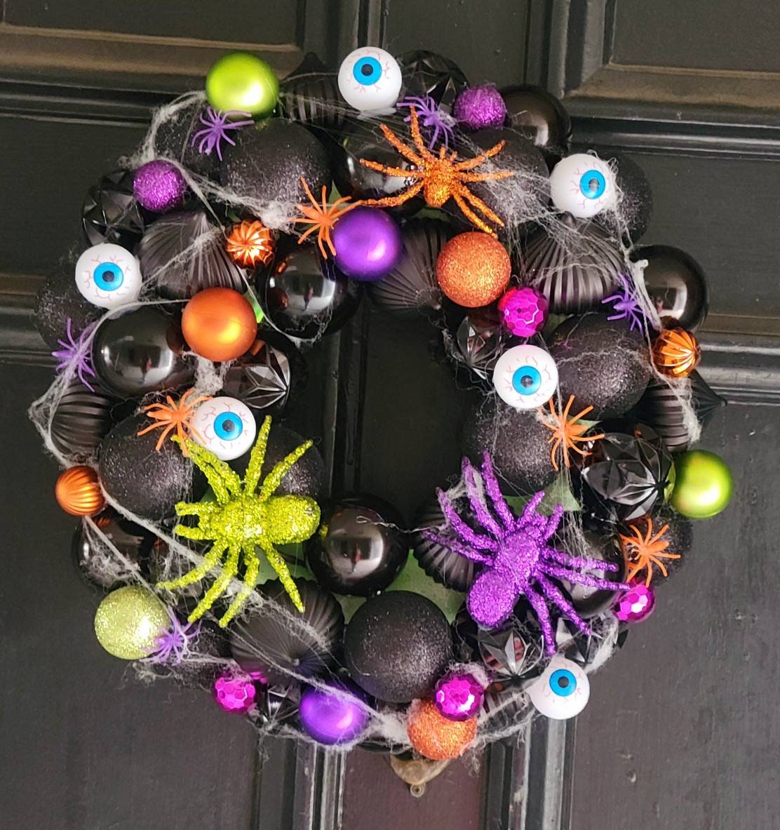 Spiders, eyeballs, and black ornament halloween wreath