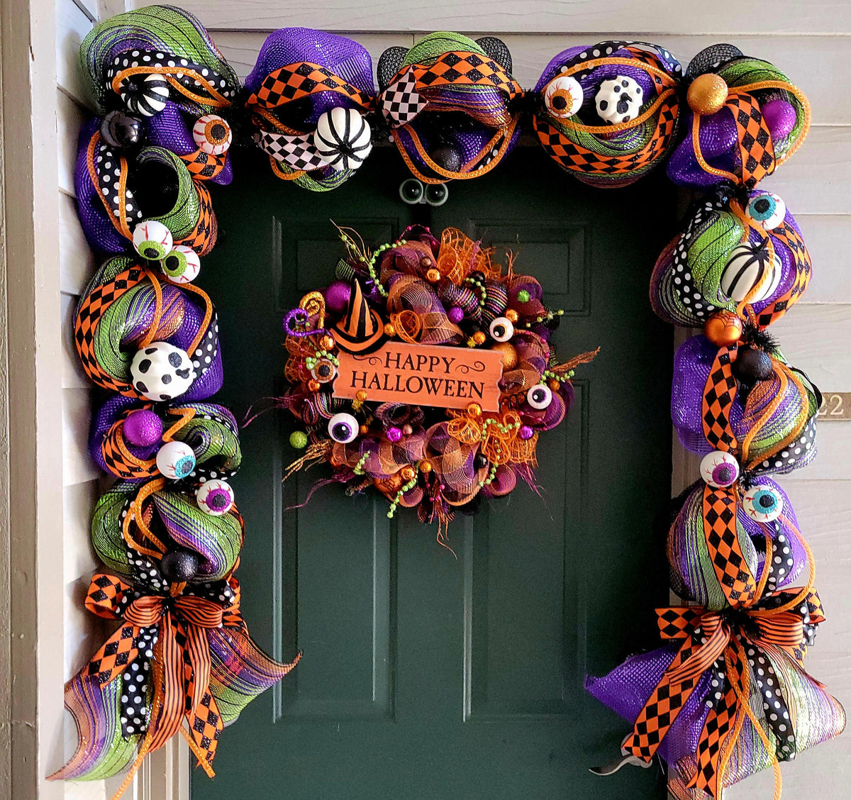 Whimsical Halloween wreath and garland set, pumpkins and eyeball decoration